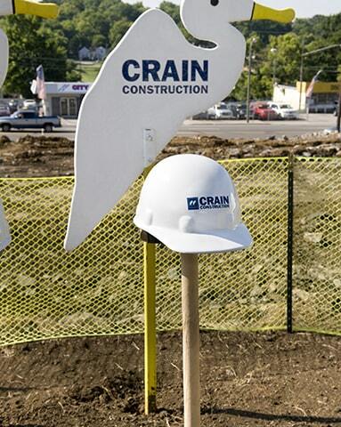 crain construction sign that is the shape of a bird outside