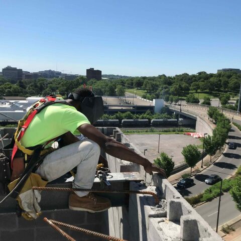 Crain construction worker on scaffolding at the element hotel job site