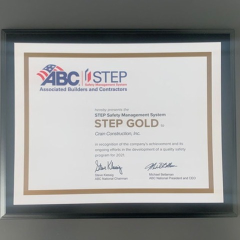 Crain construction's gold safety award certificate framed