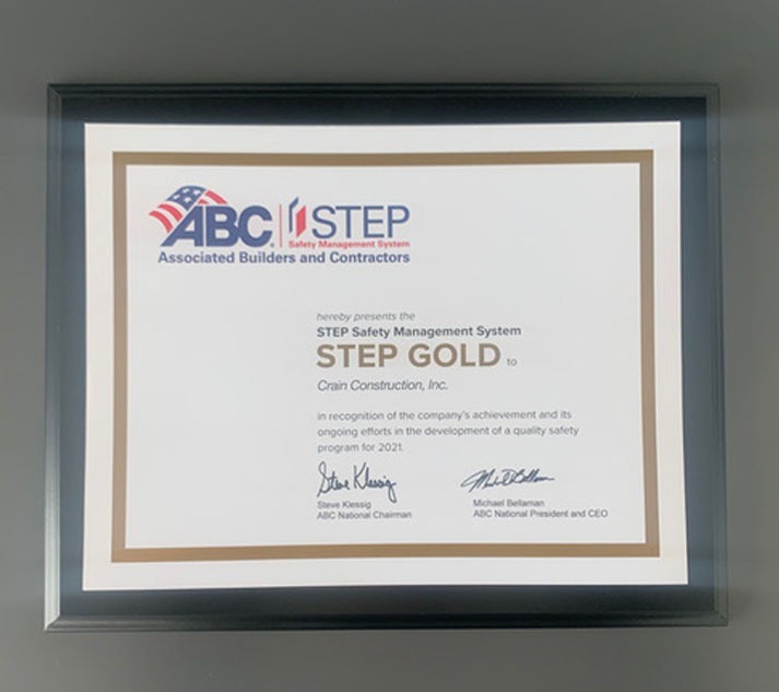 Crain construction's gold safety award certificate framed