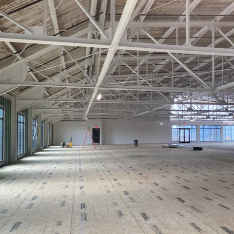 Specialty Dental Brands Headquarters under construction with exposed beams and unfinished floors.
