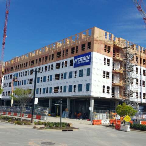 Element Onecity building under construction with crains out front.