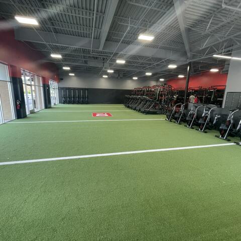 Wide shot of the turf field inside a D1 Training Facility in Spring Hill