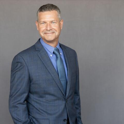 A professional portrait of Mike Gribble, VP at Crain Construction