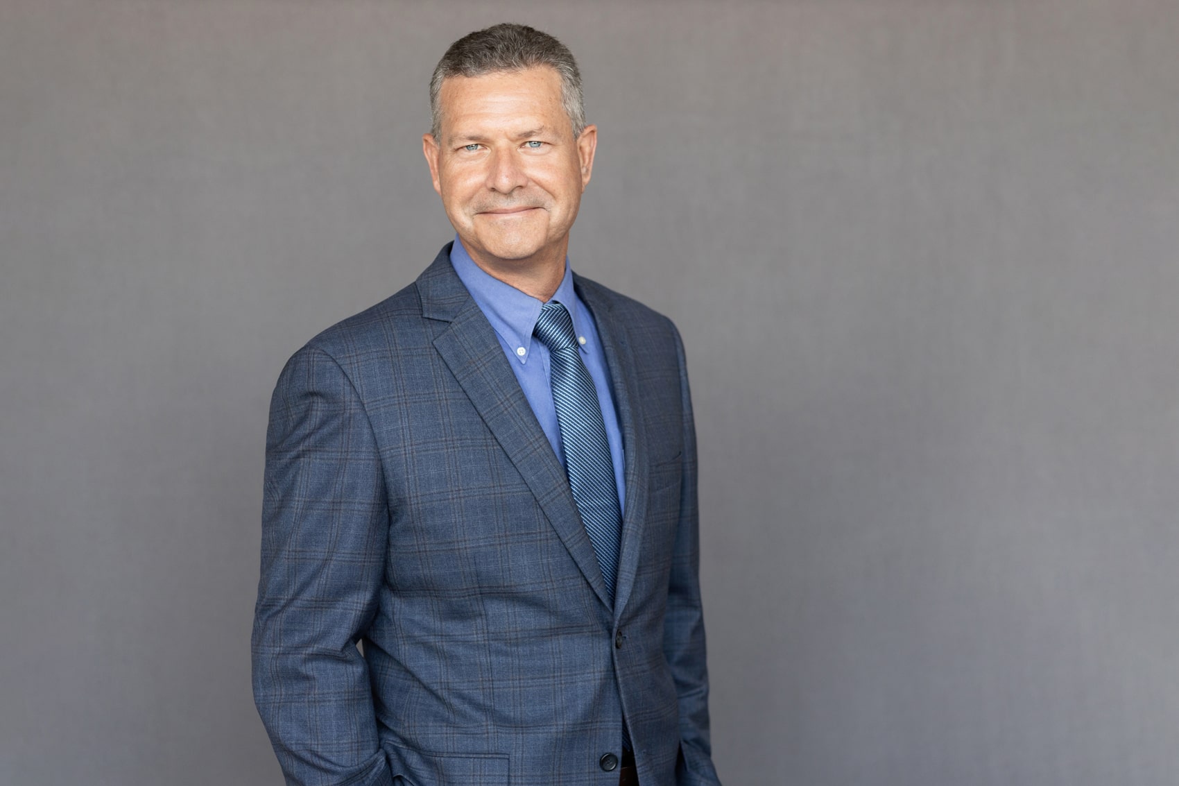A professional portrait of Mike Gribble, VP at Crain Construction