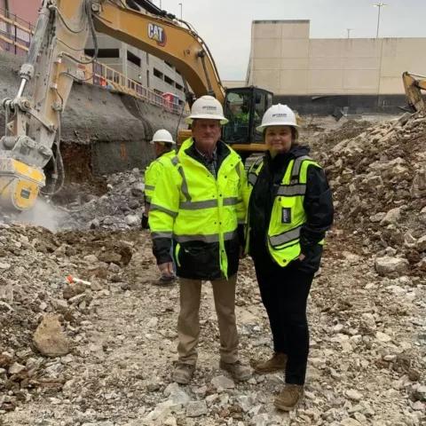 2 crain project engineers on construction site